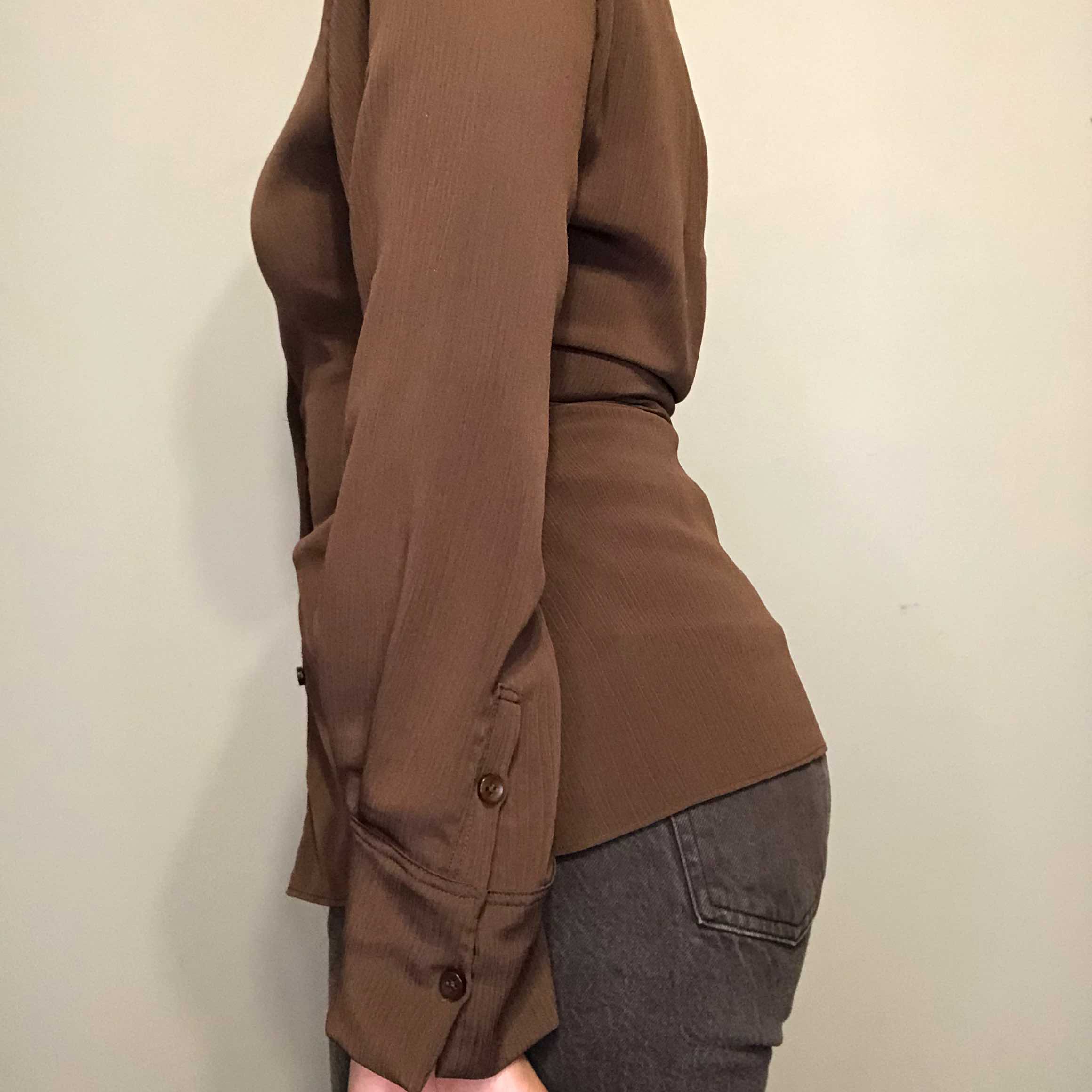 Image of brown button-up shirt.
