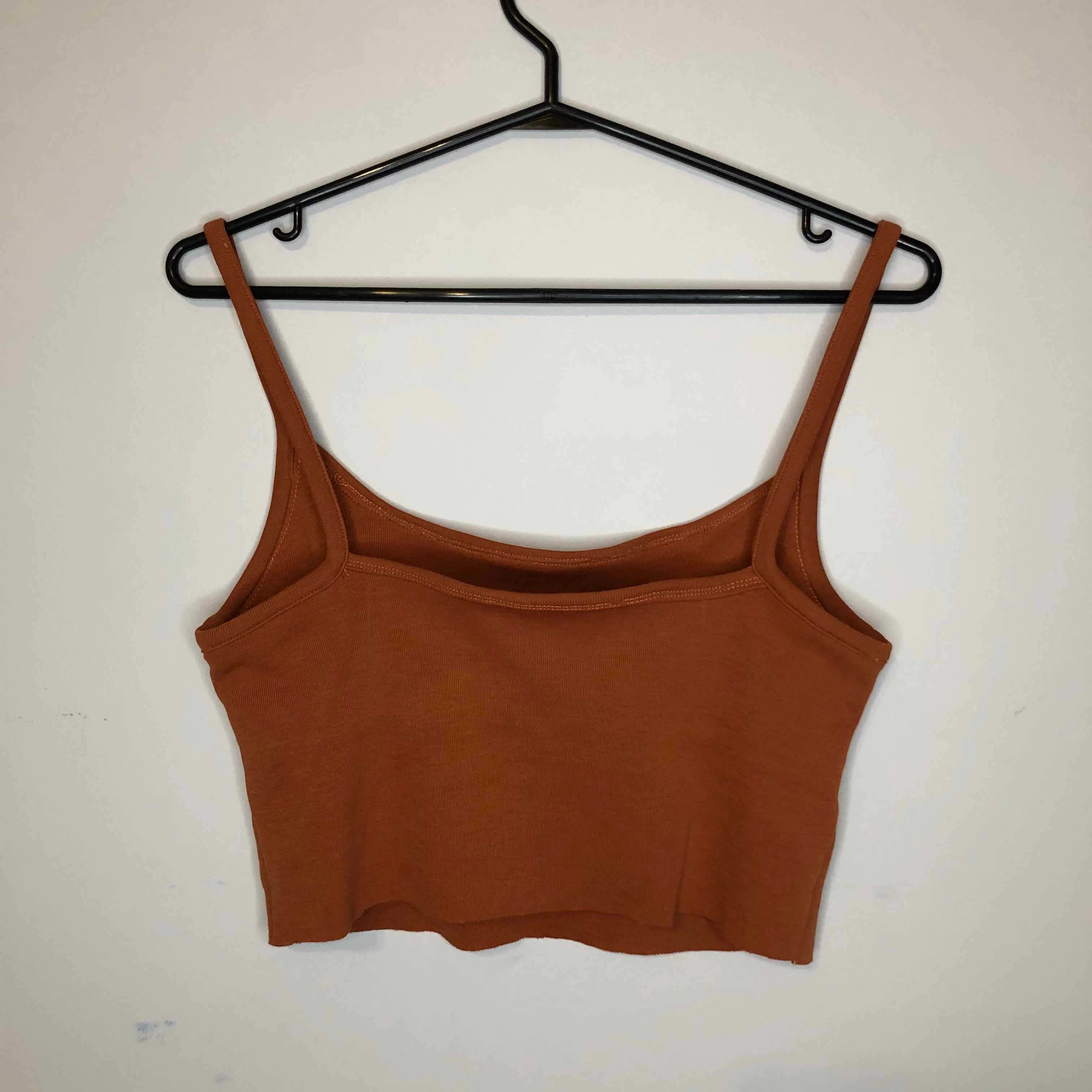Image of orange tank.