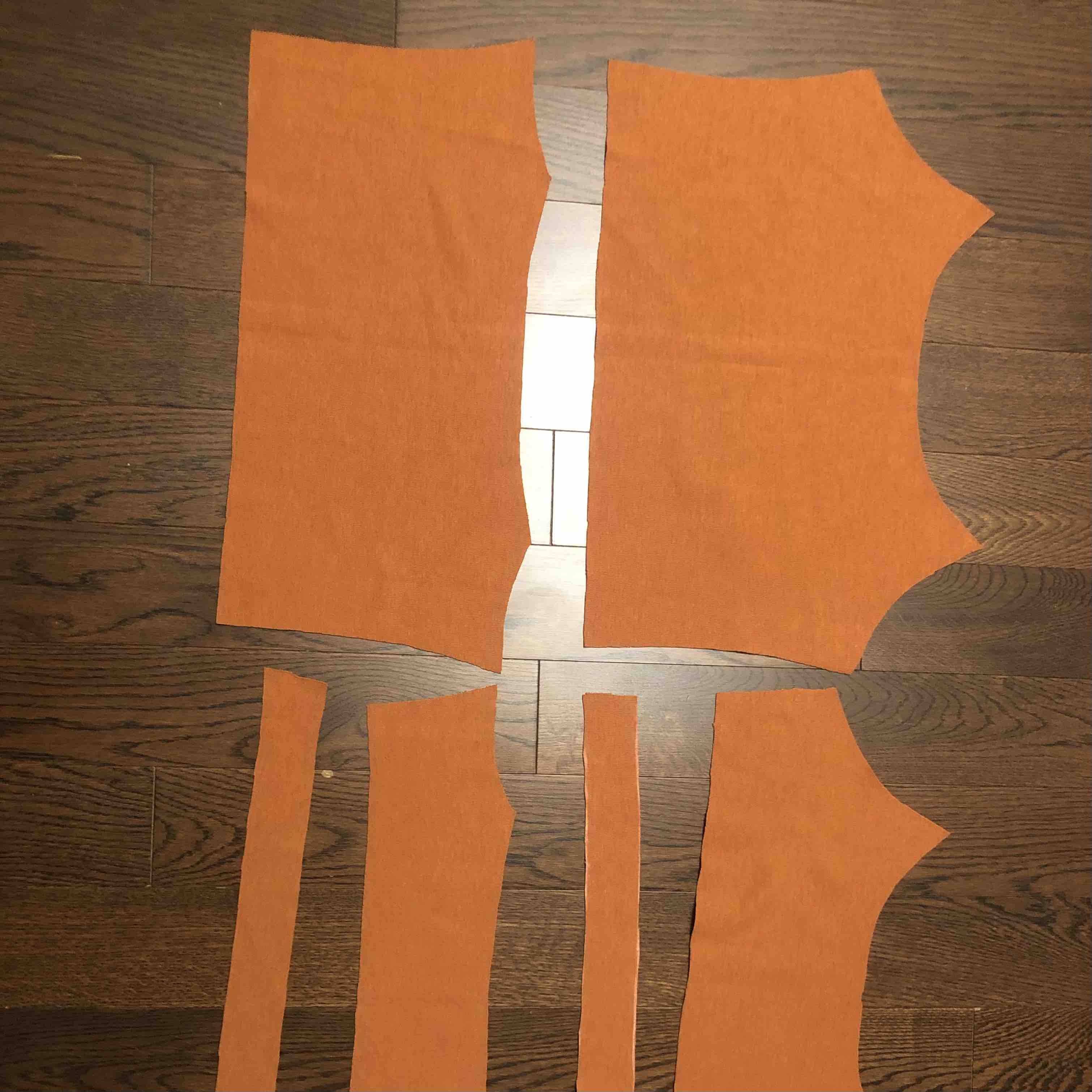 Image of fabric pieces for orange tank top.